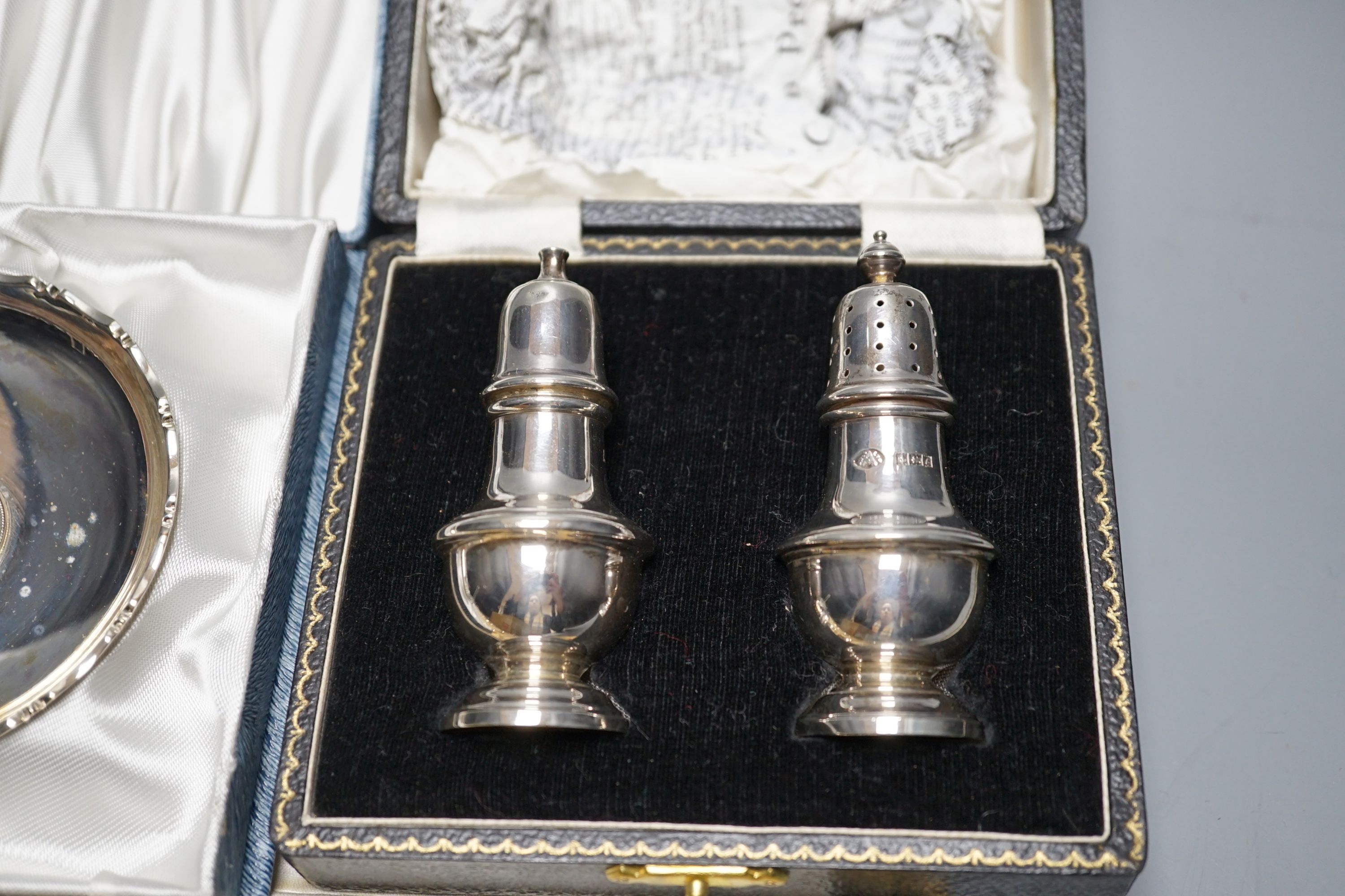 Two cased sets of six silver coffee spoons including enamel(a.f.) and bean end and three other cased sets including teaspoons with tongs, pepperettes and dish.